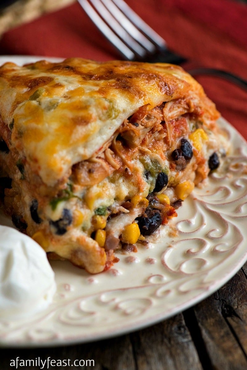Mexican Lasagna with White Sauce - A delicious and creamy lasagna filled cheese, beans, corn and chicken in a zesty cream sauce.