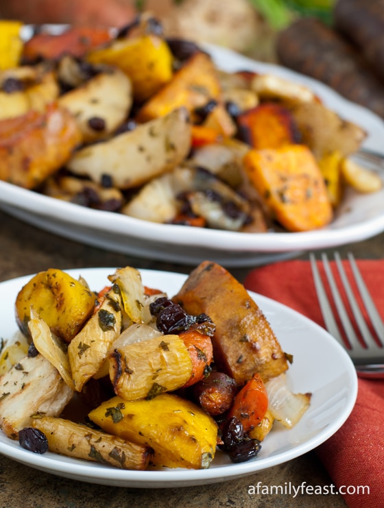 A delicious medley of roasted root vegetables including potatoes, sweet potatoes, parsnip, celery root, and beets.