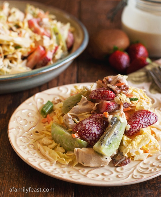 A quick and easy California Slaw recipe made with chicken, cabbage, strawberries, kiwi - all tossed with a honey-Dijon ranch dressing. Healthy and delicious!