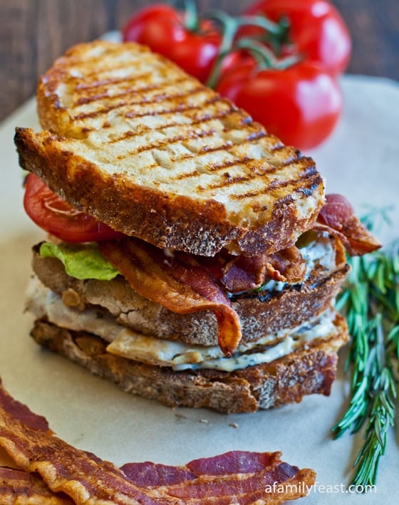Grilled Chicken Club with Rosemary Aioli - A delicious club sandwich made with grilled chicken,bacon, lettuce, tomato, and a rosemary aioli.