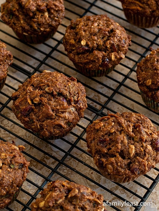 A recipe for Healthy Whole Wheat Muffins filled with dried cranberries, pineapple, shredded sweet potato, applesauce and sunflower seeds.