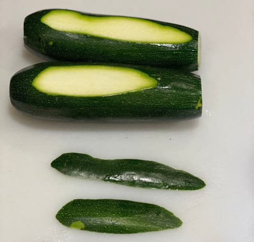 slice sliver off side of zucchini so it can lay flat