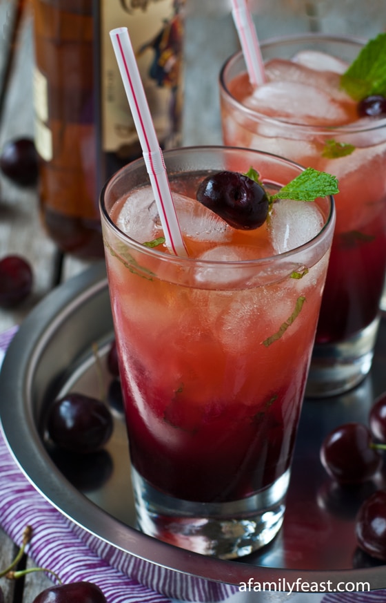 A delicious and refreshing recipe for a Fresh Cherry and Spiced Rum Cocktail.