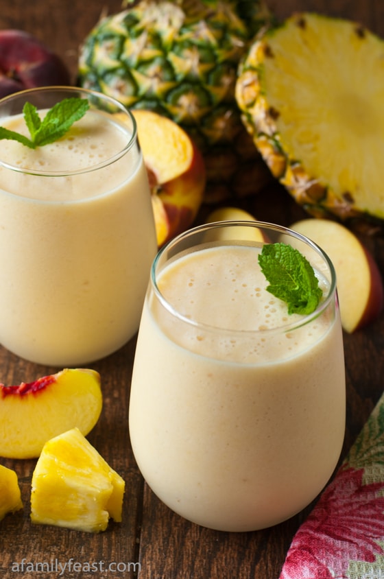 A light and delicious fresh pineapple peach smoothie made with non-fat Greek Yogurt and milk. So good!