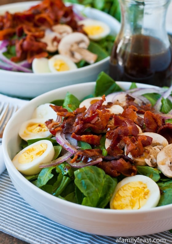 A delicious Spinach Salad recipe with an amazing Warm Bacon Dressing.