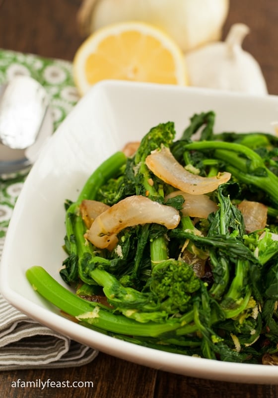 The best recipe for preparing Broccoli Rabe - lemon, garlic, onion and red pepper flakes are a perfect complement to this healthy green vegetable! Plus we also share the trick to removing the bitterness from this delicious green!