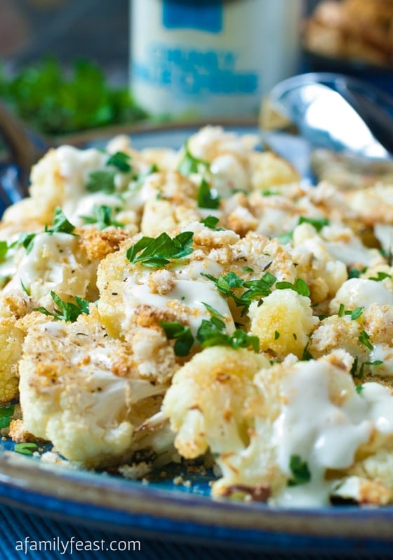 Oven Roasted Cauliflower with Crunchy Topping - Roasted cauliflower topped with crunchy croutons and a drizzle of creamy blue cheese dressing. This recipe is fantastic! #sponsored