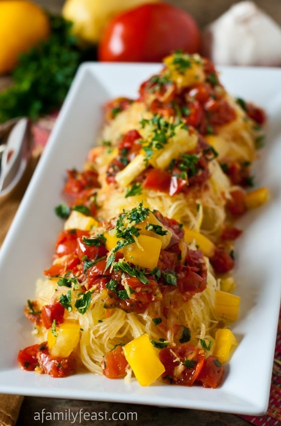 Spaghetti Squash Gremolata - Tender roasted spaghetti squash tossed with pan roasted tomatoes and a wonderful gremolata of lemon zest, garlic and parsley. This recipe is amazing!