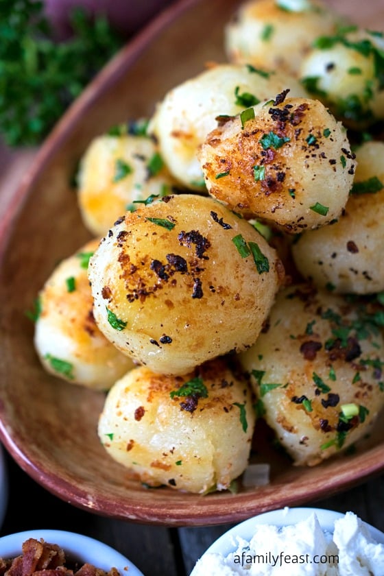 Rissole Potatoes - Simple and elegant potatoes cooked until they are crisp and golden on the outside and soft and creamy on the inside. Sprinkled with queso fresco, chives and bacon for extra flavor!