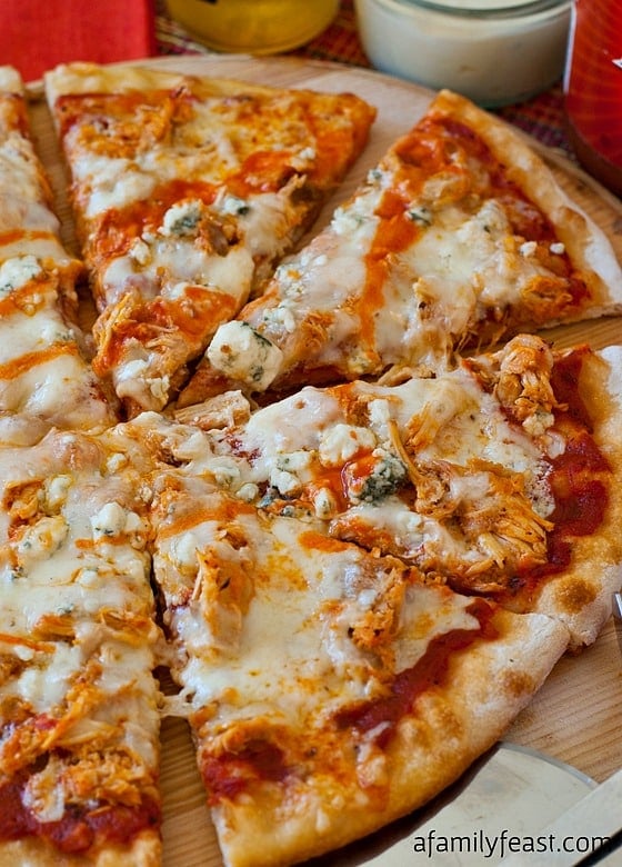 Buffalo Chicken Pizza - An outrageously good pizza (perfect for game day parties!) using our popular Slow Cooker Pulled Buffalo Chicken recipe.