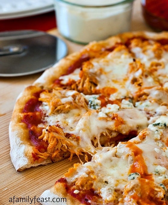 Buffalo Chicken Pizza - An outrageously good pizza (perfect for game day parties!) using our popular Slow Cooker Pulled Buffalo Chicken recipe.