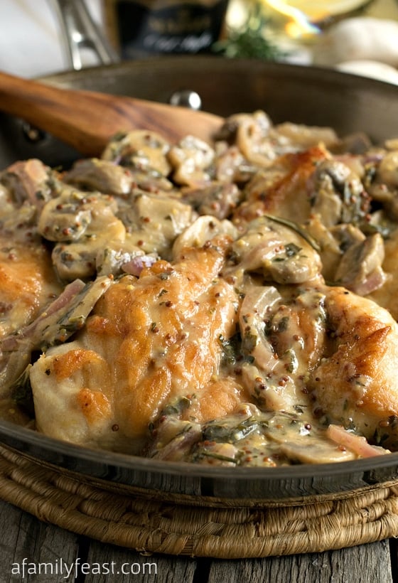Chicken Breasts with Mushroom and Onion Dijon Sauce - Tender chicken smothered in a mushroom and onion Dijon mustard sauce! Elegant and easy to make!