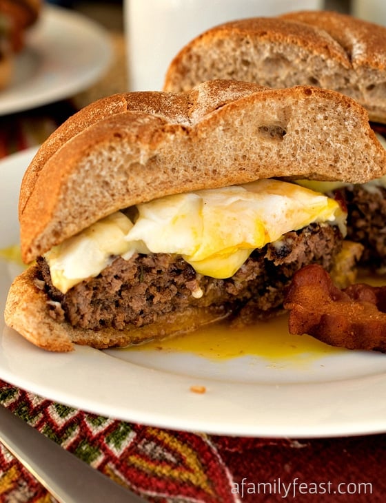 Red-Eye Burger - A hearty burger that's been seasoned with ground coffee and other spices and seasonings, then topped with melted cheese, bacon and a fried egg! This burger recipe is the best answer to any middle-of-the-night craving!