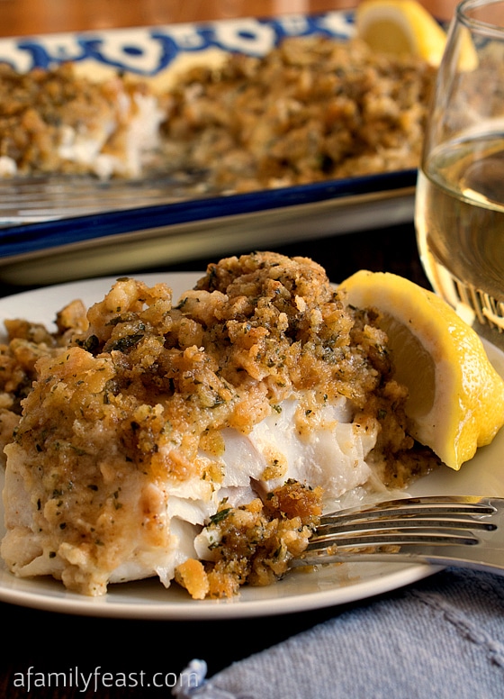 Cheesy Baked Stuffed Cod. A super moist and delicious fish recipe with a buttery crumb topping. One of our family's favorite meals!