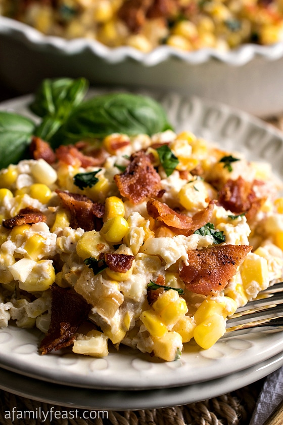 Corn and Bacon Casserole - Fresh corn kernels and bacon in a light and creamy sauce that has been flavored with garlic and basil. So good!