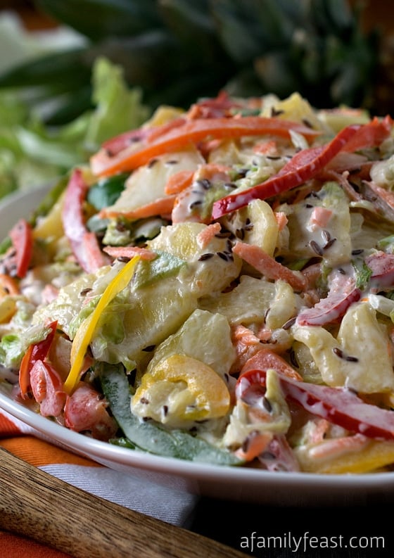 Sweet Bell Pepper Slaw with Pineapple - A delicious twist on the typical summer coleslaw recipe! You've got to try this recipe!