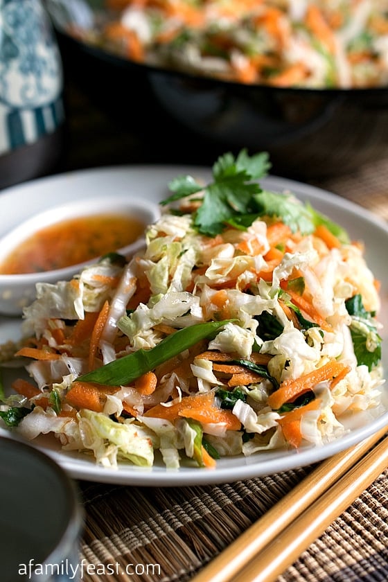 An easy Asian Slaw salad with the most fantastic dressing! This is perfect as a side dish to any Asian meal, with grilled meats or seafood, or on tacos.