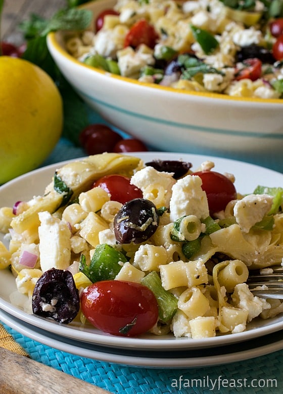Mediterranean Pasta Salad - Classic Greek flavors and ingredients combined into a delicious pasta salad. The dressing in this recipe is not to be missed!