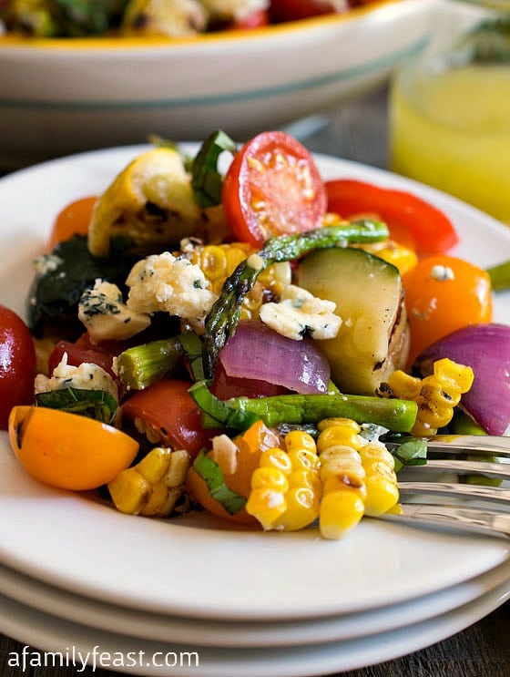 Grilled Summer Vegetable Salad uses herb-infused oils to grill summer vegetables, plus a terrific homemade dressing! This is summertime in a bowl! Grilled Summer Vegetable Salad - A Family Feast