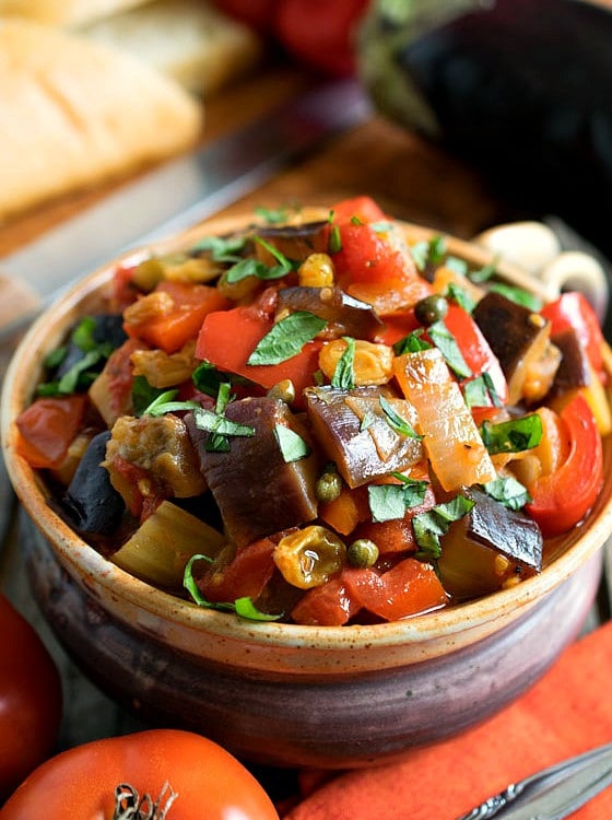 Caponata - A super flavorful and delicious Sicilian vegetable dish that is fantastic served hot or cold. Delicious spread on bread or as a side dish.