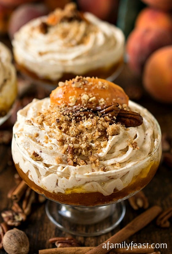 No-Bake Peach Cheesecake Mousse - A simple yet impressive dessert. Layers of sweet graham cracker crumbs, peach preserves, and a creamy and spicy peach cheesecake mousse!