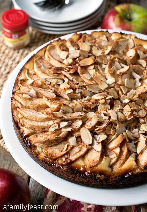 A delicious fresh apple torte with a sweet shortbread crust and cream cheese filling topped with sweet cinnamon apples and almonds.