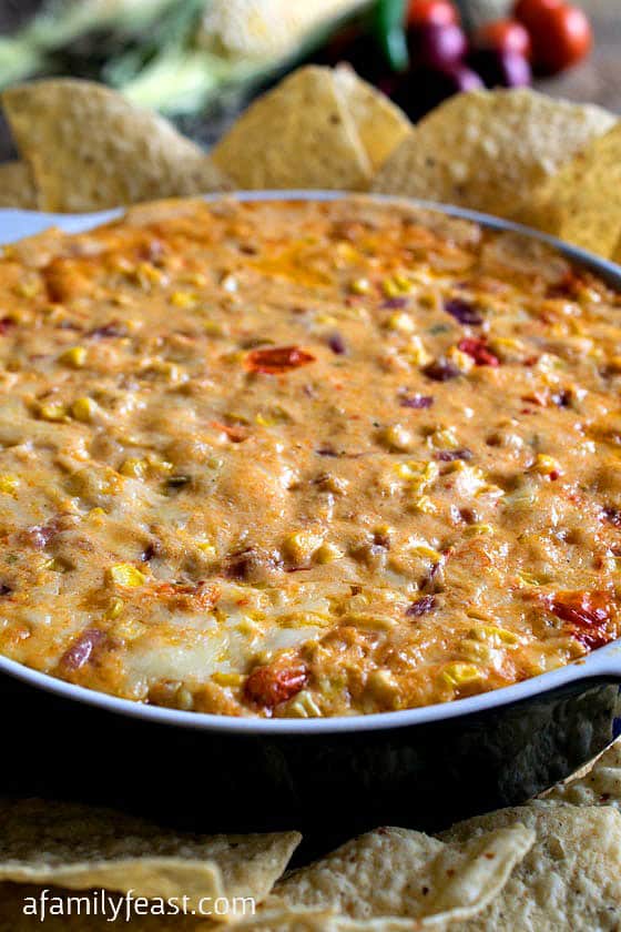 Southwestern Cheesy Corn Dip is creamy, hot and cheesy with fresh corn kernels, diced tomatoes and seasonings. YUM! Southwestern Cheesy Corn Dip