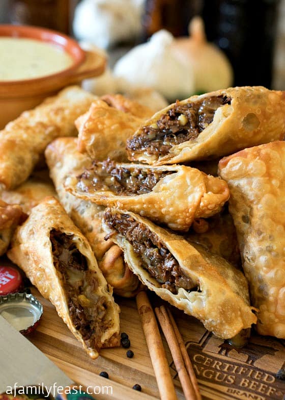 Cheesesteak Egg Rolls - Tender shredded beef brisket in crispy fried egg rolls, served with a zesty queso dipping sauce. Amazing!