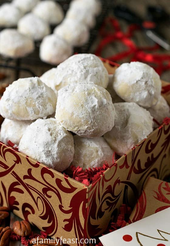 Coconut Snowball Cookies - A delicious twist on the classic snowball cookies...these have coconut flour inside, making the cookies sweeter and lighter but with the same deliciously crumbly texture.