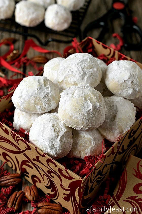 Coconut Snowball Cookies - A delicious twist on the classic snowball cookies...these have coconut flour inside, making the cookies sweeter and lighter but with the same deliciously crumbly texture.