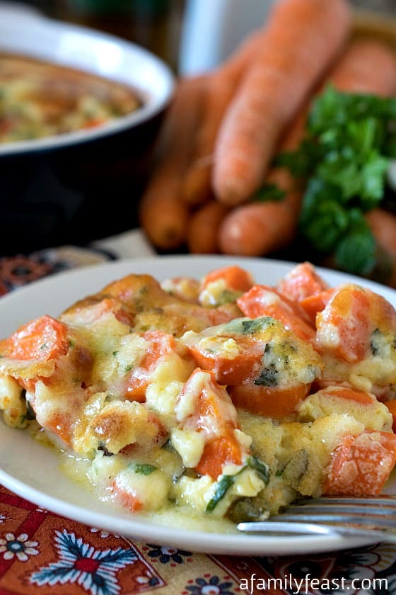 Tuscan Gilded Carrots - A cheesy and delicious side dish made with carrots, Parmesan, eggs and cream. Perfectly indulgent for a special holiday meal!