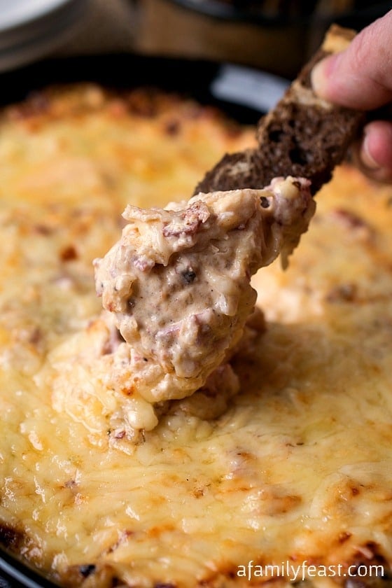 This Reuben Dip is perfect for game day! A combination of both pastrami AND corned beef, plus sauerkraut in an incredible cheesy sauce! Served with rye or pumpernickel toast - so good!