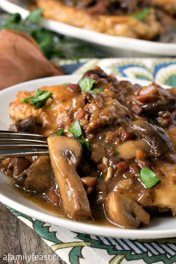 Chicken Marsala - Tender boneless chicken breasts smothered in the perfect salty-sweet Marsala wine sauce with mushrooms and pancetta. Delicious!