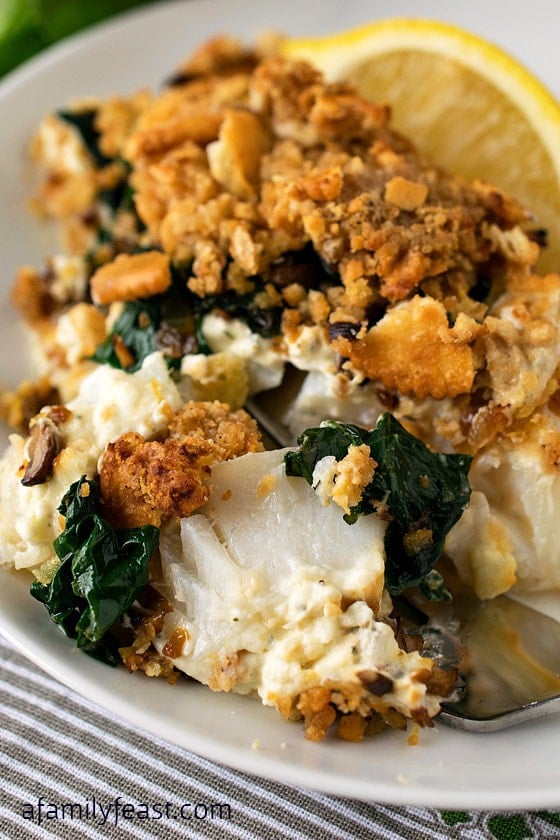 Baked Cod with Boursin - An incredible fish dinner! Super moist fish topped with Boursin cheese, spinach, mushrooms and a cracker topping!