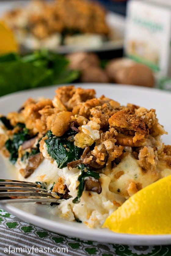 Baked Cod with Boursin - An incredible fish dinner! Super moist fish topped with Boursin cheese, spinach, mushrooms and a cracker topping!