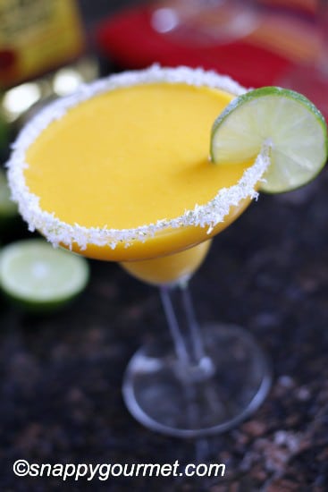This frozen mango coconut margarita is one of over 30 refreshing margarita recipes in a collection on afamilyfeast.com