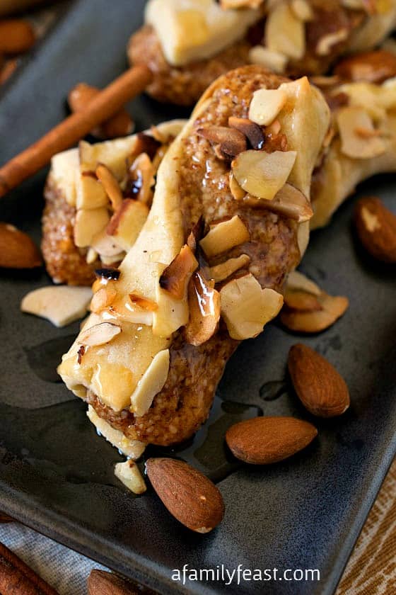 Sicilian Twists - A rich sweet Italian shortbread cookie with an almond, cinnamon and honey filling and topped with a drizzle of honey and more toasted almonds. Perfectly sweet and delicious!