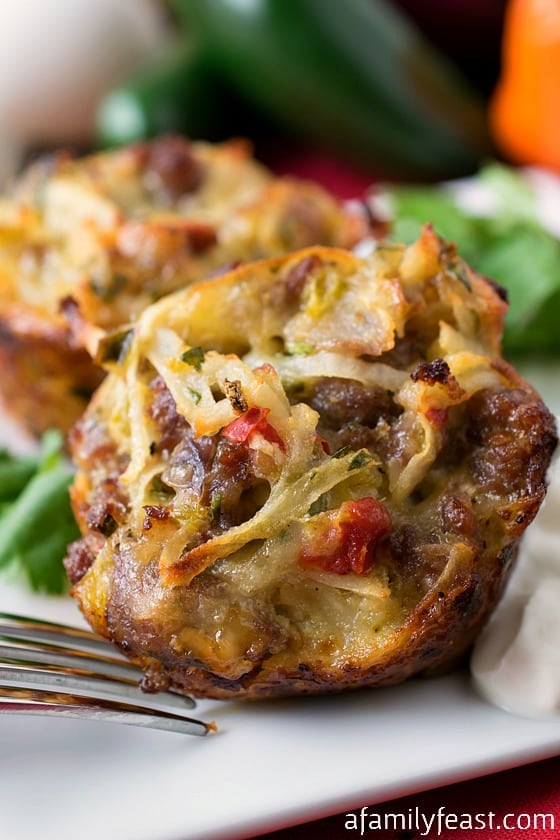 Southwestern Breakfast Muffins - An easy and delicious breakfast on-the-go. Muffins made with cheese, sausage, hashbrowns, eggs and peppers!