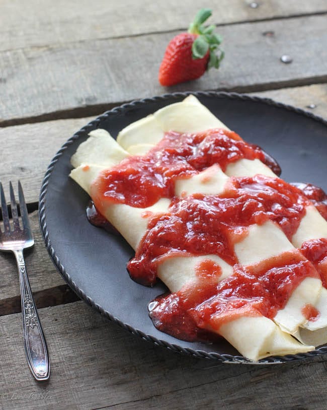 Strawberry Ricotta Crepes - One of over 30 beautiful brunch recipes for Mother's Day, or any special occasion! The collection includes main dishes, appetizers, drinks, and desserts. | A Family Feast