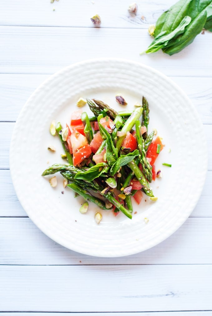 Tomato and Asparagus Salad - One of over 30 Amazing Asparagus Recipes to give you cooking inspiration this Spring! See the collection on A Family Feast