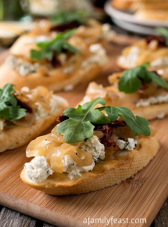 Onion Jam Crostini with Herbed Goat Cheese - A delicious, elegant appetizer that is easy to make and super delicious!