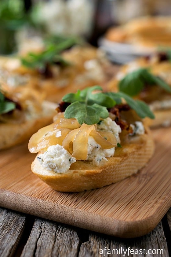 Onion Jam Crostini with Herbed Goat Cheese - A delicious, elegant appetizer that is easy to make and super delicious!