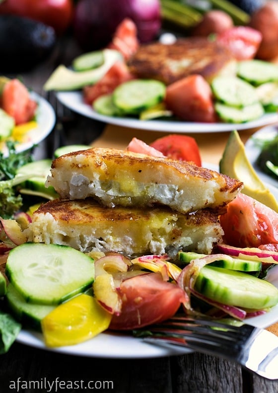 Summer Salad with Goat Cheese-Filled Potato Cakes - Crisp fresh garden vegetables tossed with a zesty dressing and topped with a warm and crispy goat cheese-filled potato cake. Delicious!