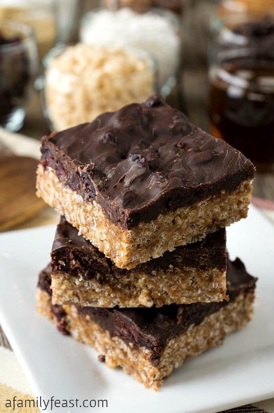 Loaded Chocolate Covered Rice Krispie Bars - A delicious crispy chewy bottom topped with a sweet tart chocolate ganache. (You'll be surprised at all the healthy ingredients included in this delicious desserts!)
