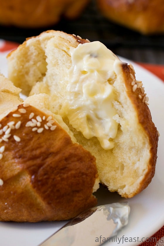 Soft Honey Sesame Pretzel Rolls - It's easy to make these delicious soft honey sesame pretzel rolls at home!