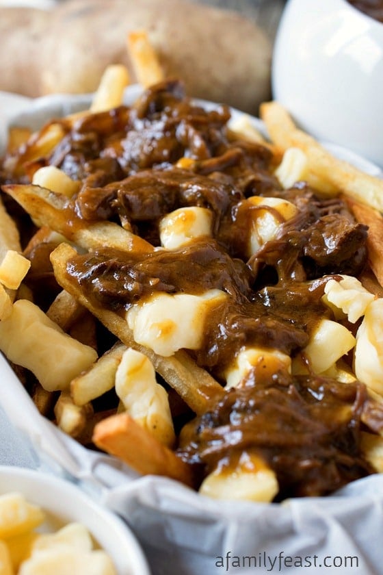 Poutine - A delicious, classic Canadian dish made from French fries, cheese curds and gravy!  Pure comfort food!