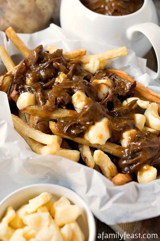 Poutine - A delicious, classic Canadian dish made from French fries, cheese curds and gravy!  Pure comfort food!