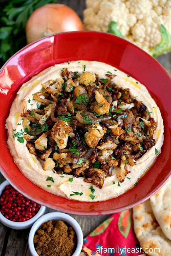 Hummus with Caramelized Cauliflower and Onions - Creamy hummus topped with spiced caramelized onions and cauliflower. So delicious!