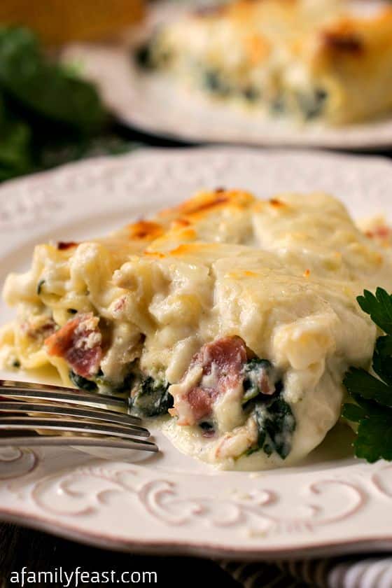 White Lasagna Chicken Rollups - Ultimate creamy, cheesy comfort food! Lasagna with chicken, prosciutto, and spinach in a cream sauce. Delicious!