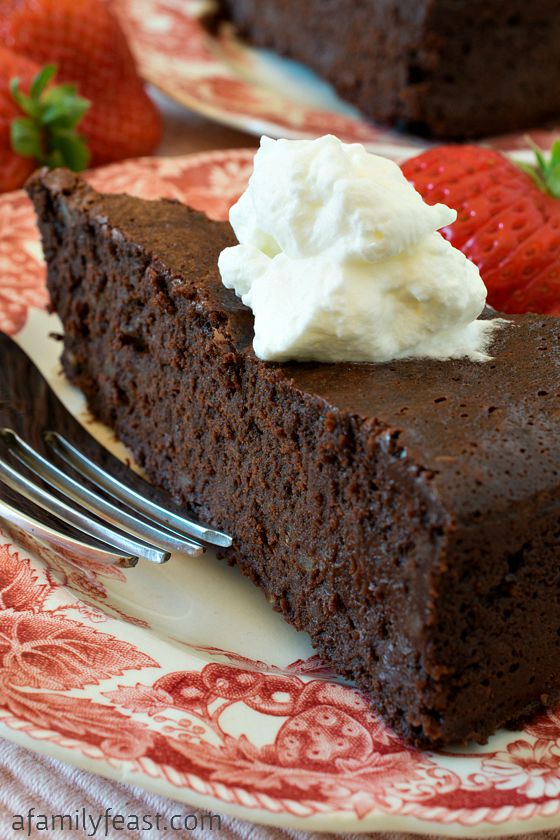 Chocolate-Bourbon Pecan Torte - A decadent, rich flourless chocolate cake made even more decadent with bourbon added! Crazy rich and delicious!